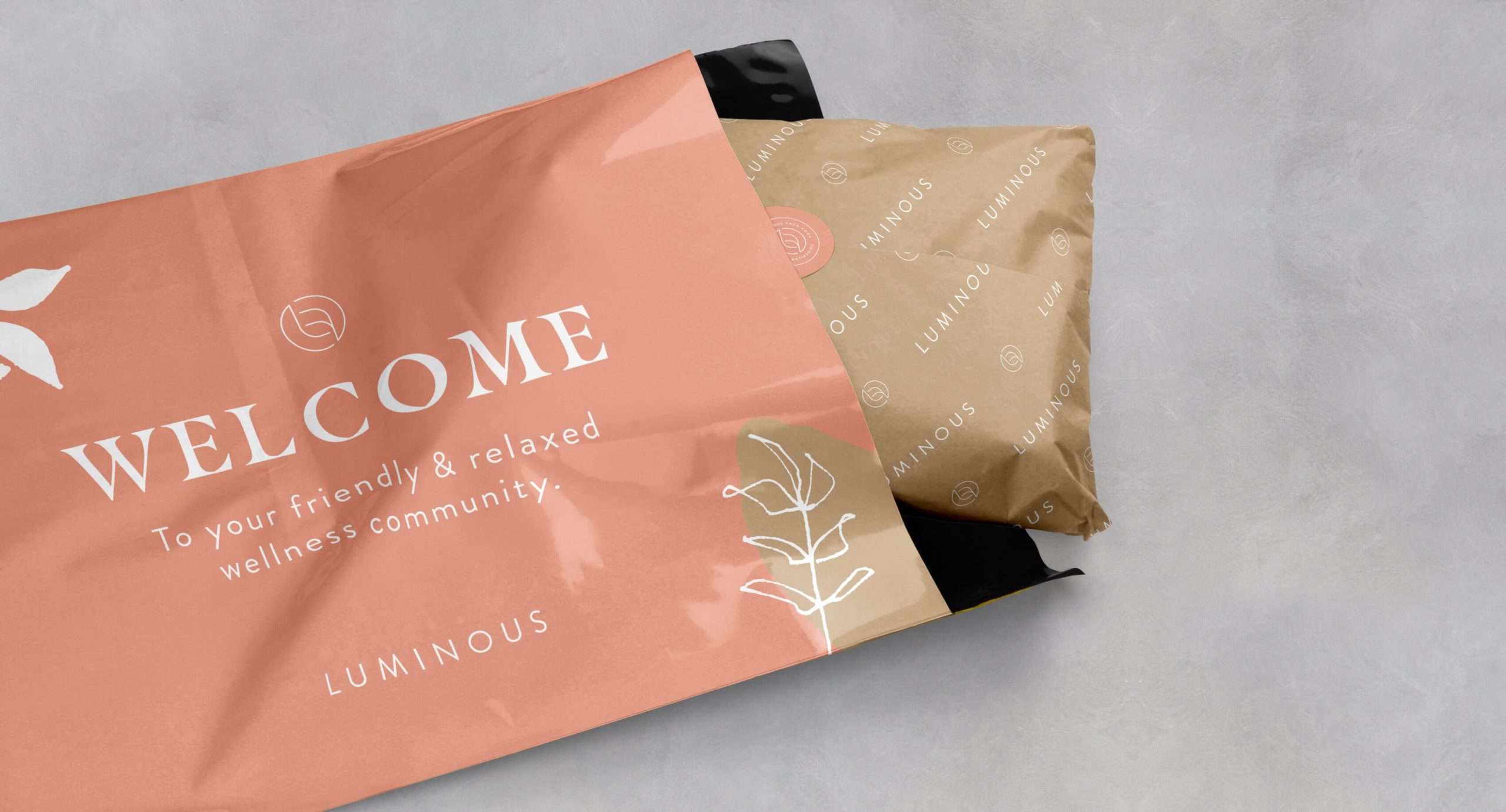 Branded Welcome packaging envelope with Lumious products including face roller and gua sha tool